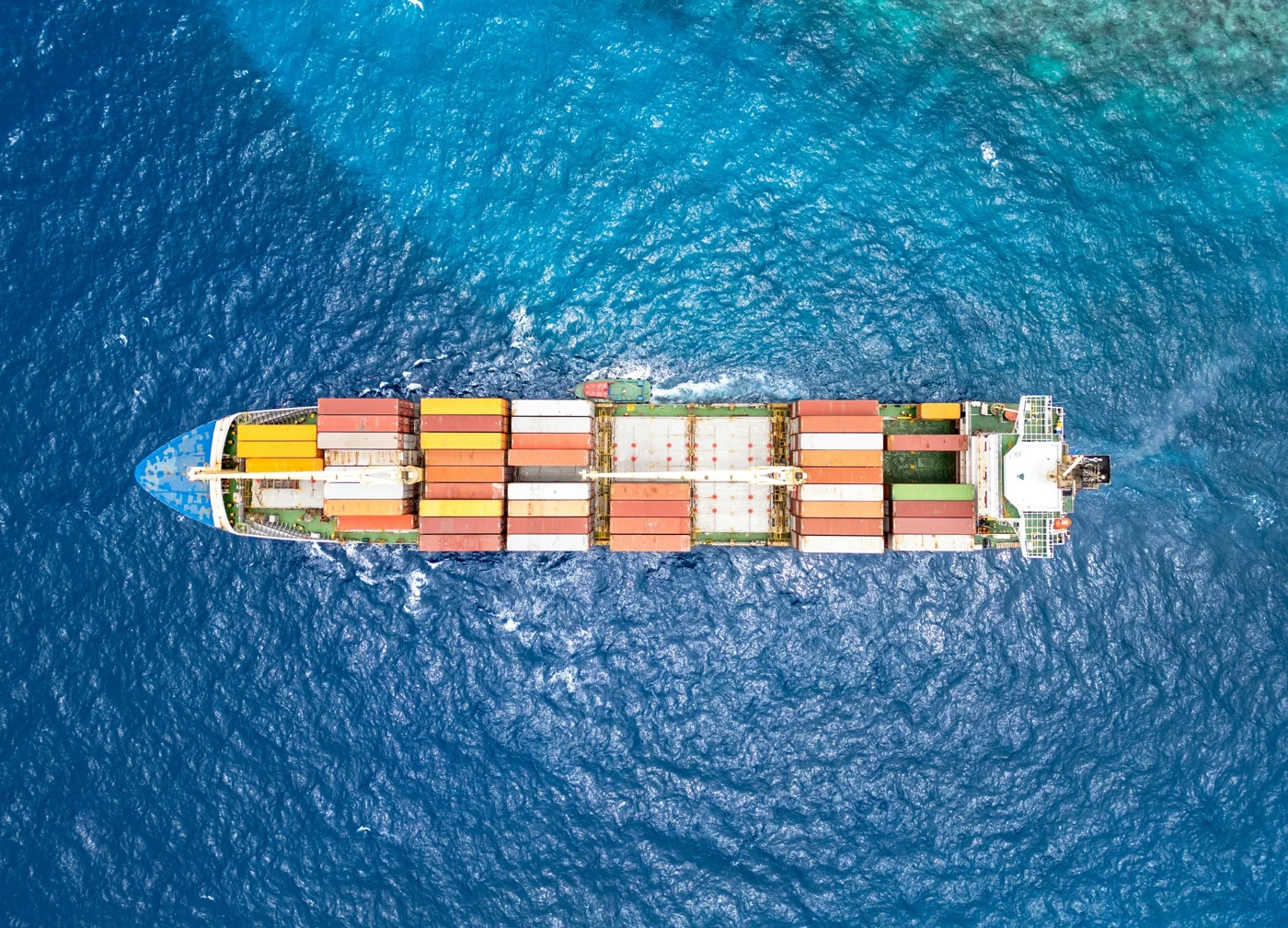 A container ship at sea photographed from above