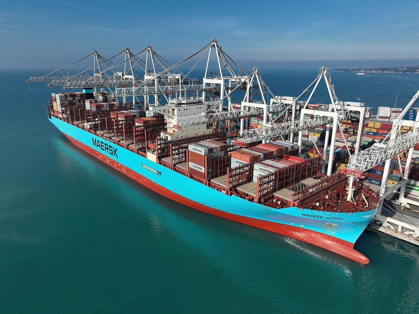 Container terminal with cranes and a cargo ship